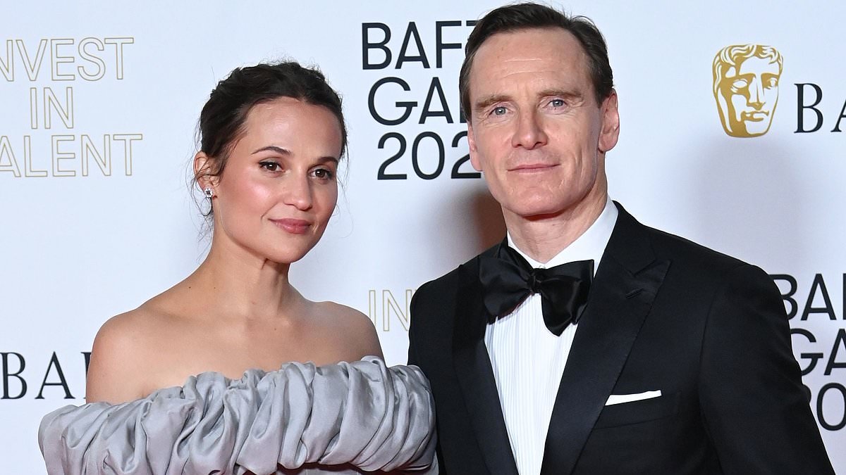 Alicia Vikander exudes elegance in a grey off-the-shoulder gown as she joins husband Michael Fassbender at star-studded BAFTA Invest in Talent Gala